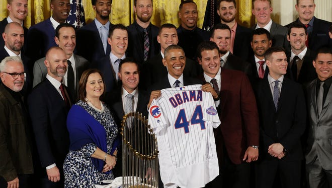 President Obama poses with with the World Series champion Cubs.