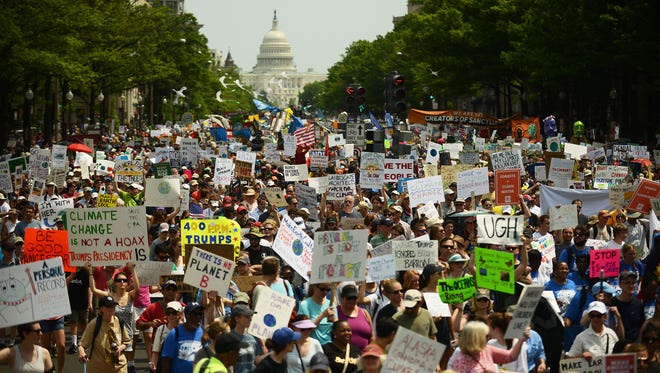 People march from the U.S. Capitol to the White House for the People's Climate March in Washington, D.C.