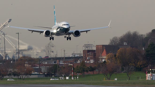 The Boeing 737 MAX8 returns to Boeing Field in Seattle after a test flight on Nov. 19, 2016.