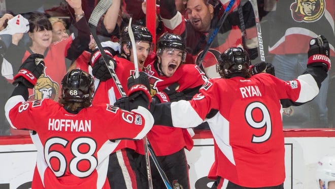 Ottawa Senators players celebrate their double-overtime win over the New York Rangers.