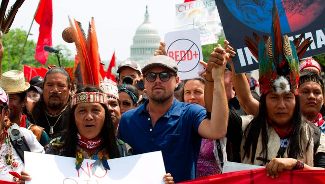 US actor Leonardo DiCaprio, center, marches with a group of indigenous people from North and South America, during the People's Climate March in Washington D.C. on April, 29, 2017.