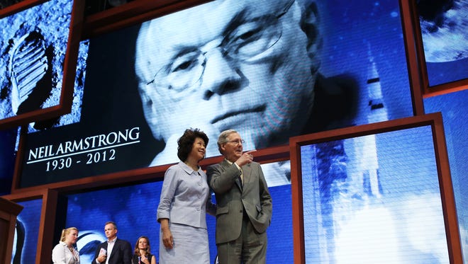 Sen. Mitch McConnell and Elaine Chao stand on stage ahead of the Republican National Convention on Aug. 26, 2012, in Tampa.