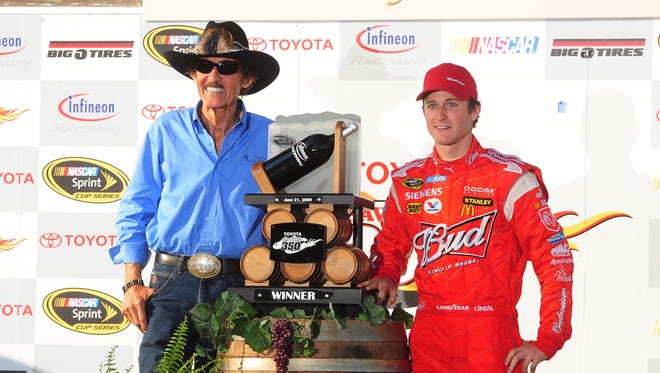 Kasey Kahne, right, took owner Richard Petty to victory lane for the first time in 364 races in June 2009 at Sonoma. Kahne became a part of Richard Petty Motorsports at the beginning of 2009 after a merger with his previous team Gillett Evernham Motorsports.