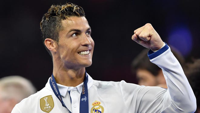 Real Madrid's forward Cristiano Ronaldo celebrates winning the UEFA Champions League final.