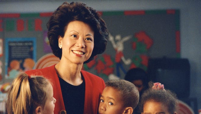 Chao visits with children at a United Way-funded daycare center while she was president and CEO of United Way of America.