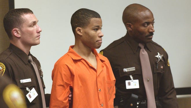 Sniper suspect Lee Boyd Malvo is escorted by deputies as he is brought into court to be identified  Oct. 22, 2003 in Virginia Beach, Va.