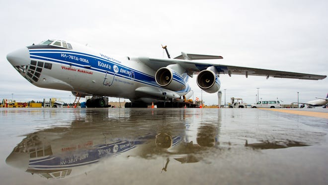 A Russian-built Ilyushin IL-76 cargo jet rests in the rain as it awaits a load of heavy drilling equipment at Seattle-Tacoma International Airport on Nov. 2, 2016.