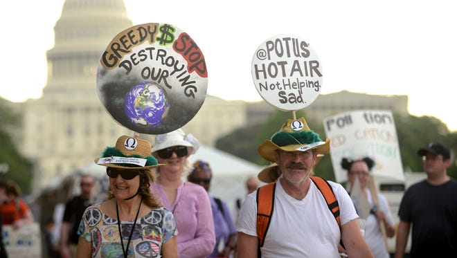 People gather near the U.S. Capitol for the People's Climate March before marching to the White House to protest President Donald Trump's envirnomental policies on April 29, 2017 in Washington, D.C.