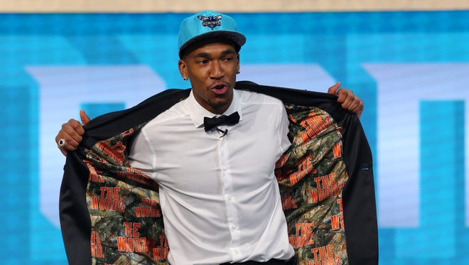 Malik Monk shows off the inside of his suit jacket after being selected No. 11 by the Hornets during the first round of the 2017 NBA draft at Barclays Center.