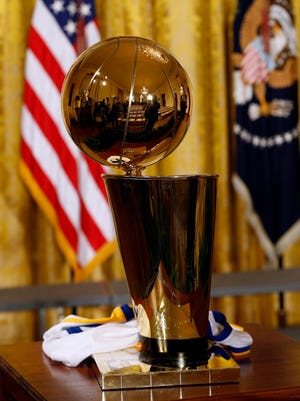 The NBA championship Trophy rests on a table prior to a ceremony honoring the 2015 NBA champion Golden State Warriors.