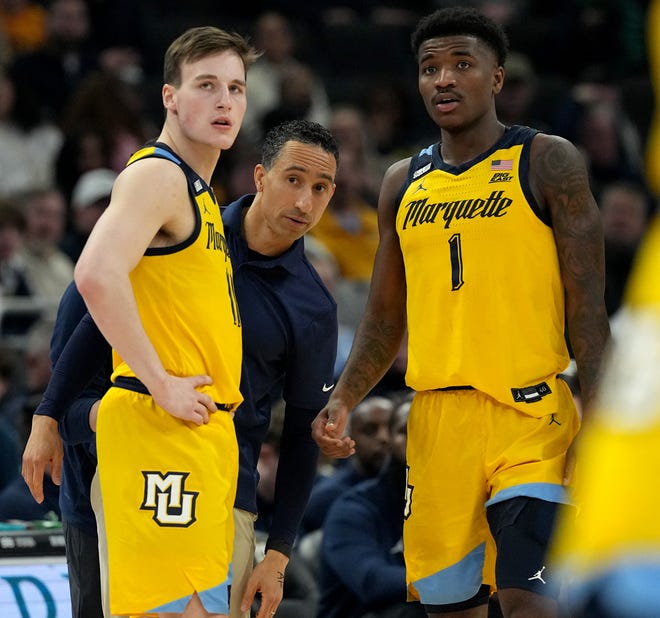 Marquette head coach Shaka Smart talks with guard Tyler Kolek (11) and guard Kam Jones (1) during the first half of their game against Butler Wednesday, January 10, 2024 at Fiserv Forum in Milwaukee, Wisconsin.