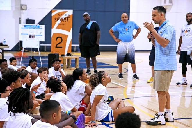 Marquette University men’s head basketball coach Shaka Smart talks with youth attending the SC Johnson and 4th Family Camp at Marquette University. In addition to a variety of drills, youth were also exposed to the science behind the sports they love to play at the camp on Monday, July 11, 2022.
