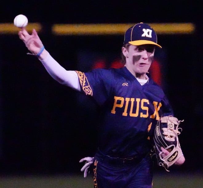 Pius XI second baseman Riley Curran (1) throws to first during the game against Waukesha South at Frame Park in Waukesha, Thursday, March 28, 2024.