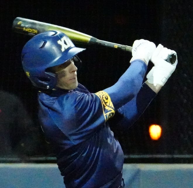 Pius XI's Zachary Denneau (7) drives one to center field during the game against Waukesha South at Frame Park in Waukesha, Thursday, March 28, 2024.