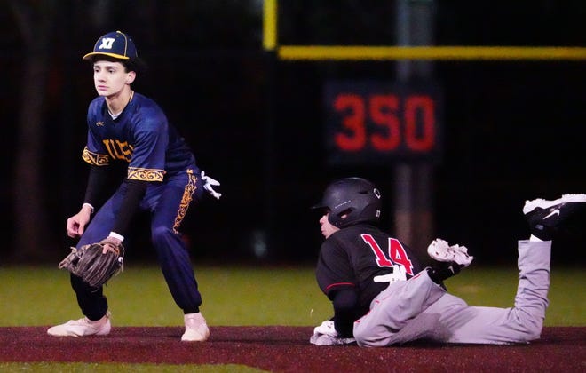 Waukesha South's Alex Montez (14) steals second as Pius XI shortstop Mariano Rivera (2) waits for the throw at Frame Park in Waukesha, Thursday, March 28, 2024.
