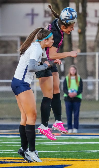 Kettle Moraine's Samantha Brown (11) elevates for a header over Brookfield Academy's Gretchen Peacock (7) during the match at Kettle Moraine on Friday, April 5, 2024.