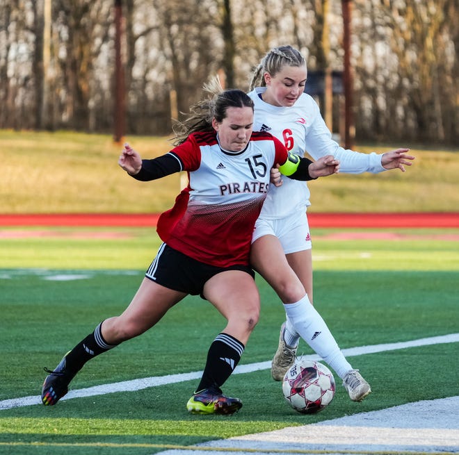 Pewaukee's Ella Opie (15) battles Arrowhead's Ava Oleniczak (6) for possession during the match at Pewaukee, Friday, April 12, 2024.