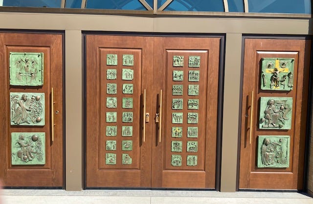 St. Charles Parish, a Roman Catholic church in Hartland, built a new church. One of its features is these bronze plaques which are replicas of the ones on the main doors of the Basilica di San Zeno Maggiore in Verona, Italy.