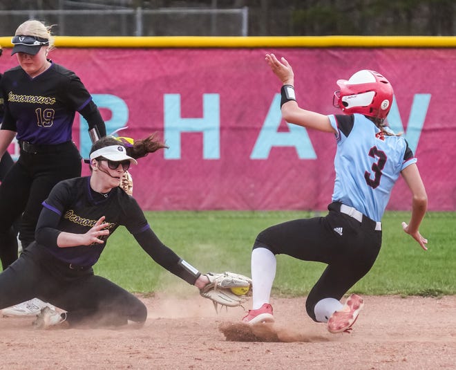 Oconomowoc shortstop Maddie Hamersmeier (12) gets the tag at second on Arrowhead's Molly Boerst (3) during the game at Arrowhead, Tuesday, April 16, 2024.