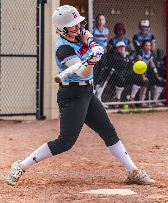 Arrowhead's Ashley Gilroy (20) connects for a single to center field during the game at home against Oconomowoc, Tuesday, April 16, 2024.