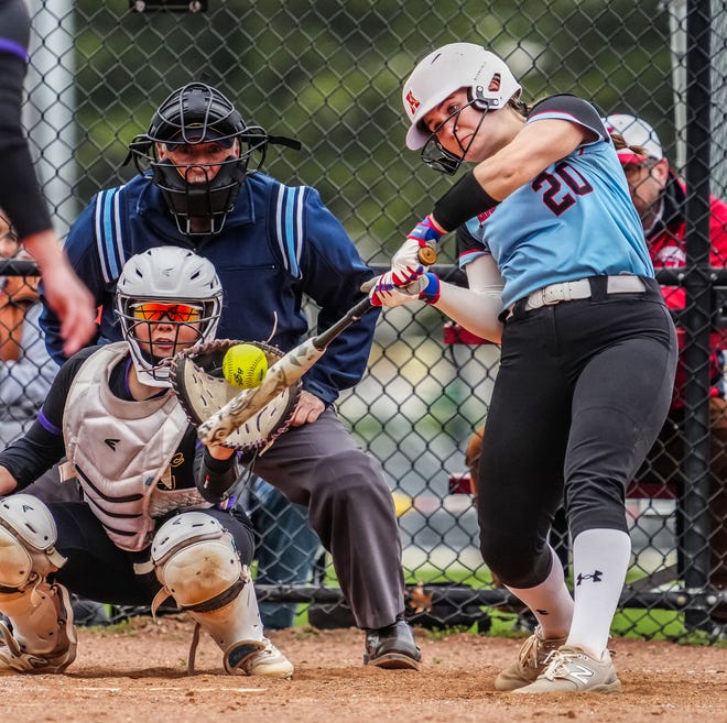 Arrowhead's Ashley Gilroy (20) connects during the game at home against Oconomowoc, Tuesday, April 16, 2024. Gilroy hit a walk-off 2-run home run in extra innings to give her team a 10-8 victory.
