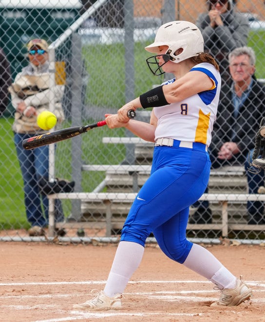 Germantown's Julia Sina (8) hits a sac fly to center field during the game at home against Brookfield East, Tuesday, April 23, 2024.
